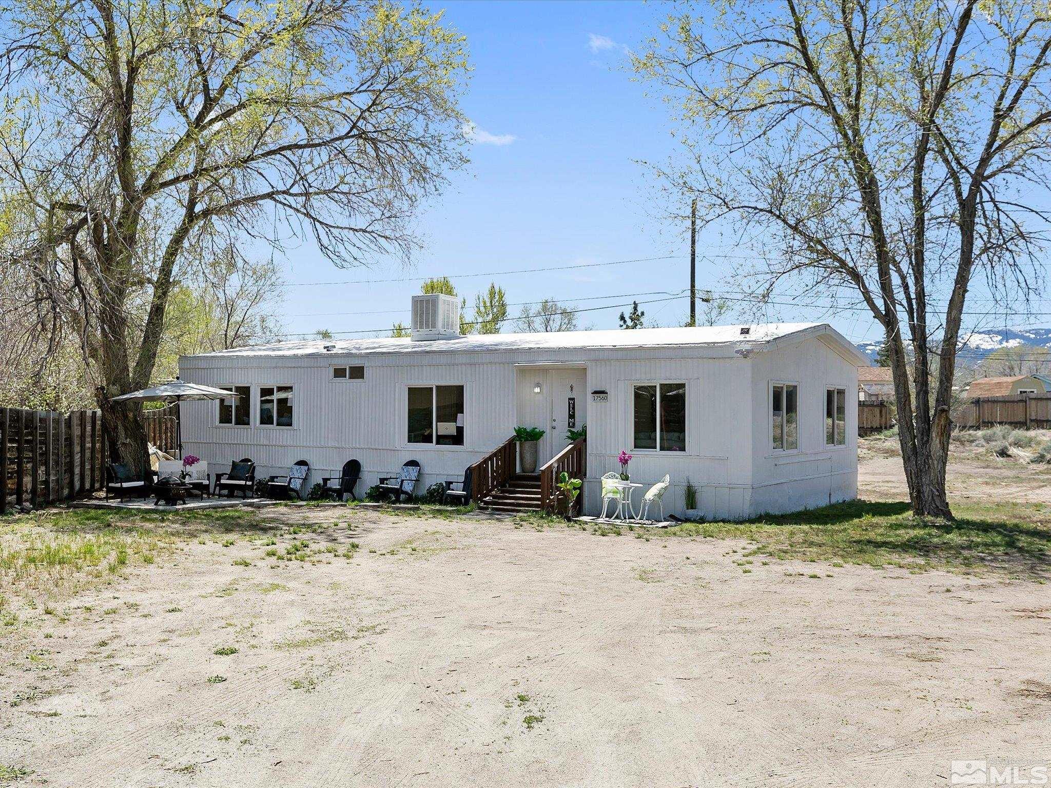 17560 Thrush Lane Reno, NV 89508 - Photo 2 of 27 a view of a house with a yard covered with snow in the roadside