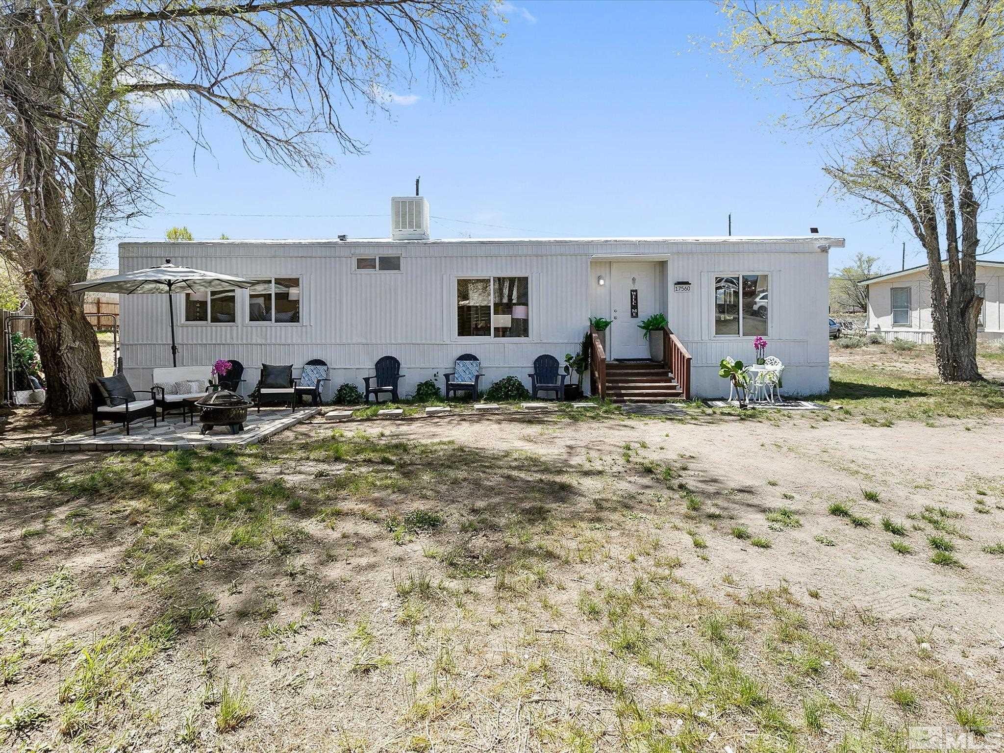 17560 Thrush Lane Reno, NV 89508 - Photo 3 of 27 a front view of a house with a yard