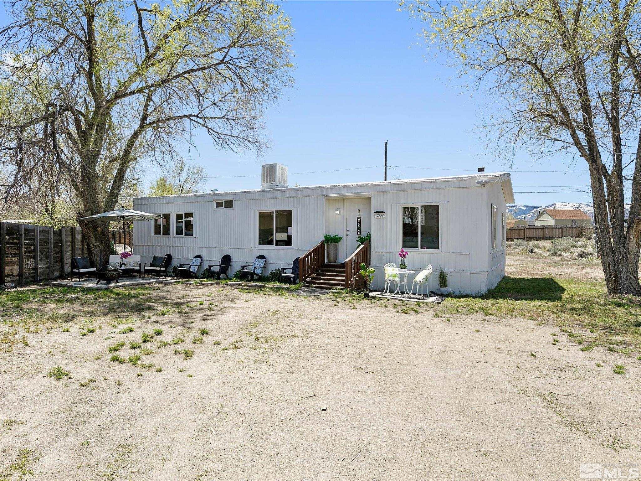 17560 Thrush Lane Reno, NV 89508 - Photo 4 of 27 a view of a yard with a tree