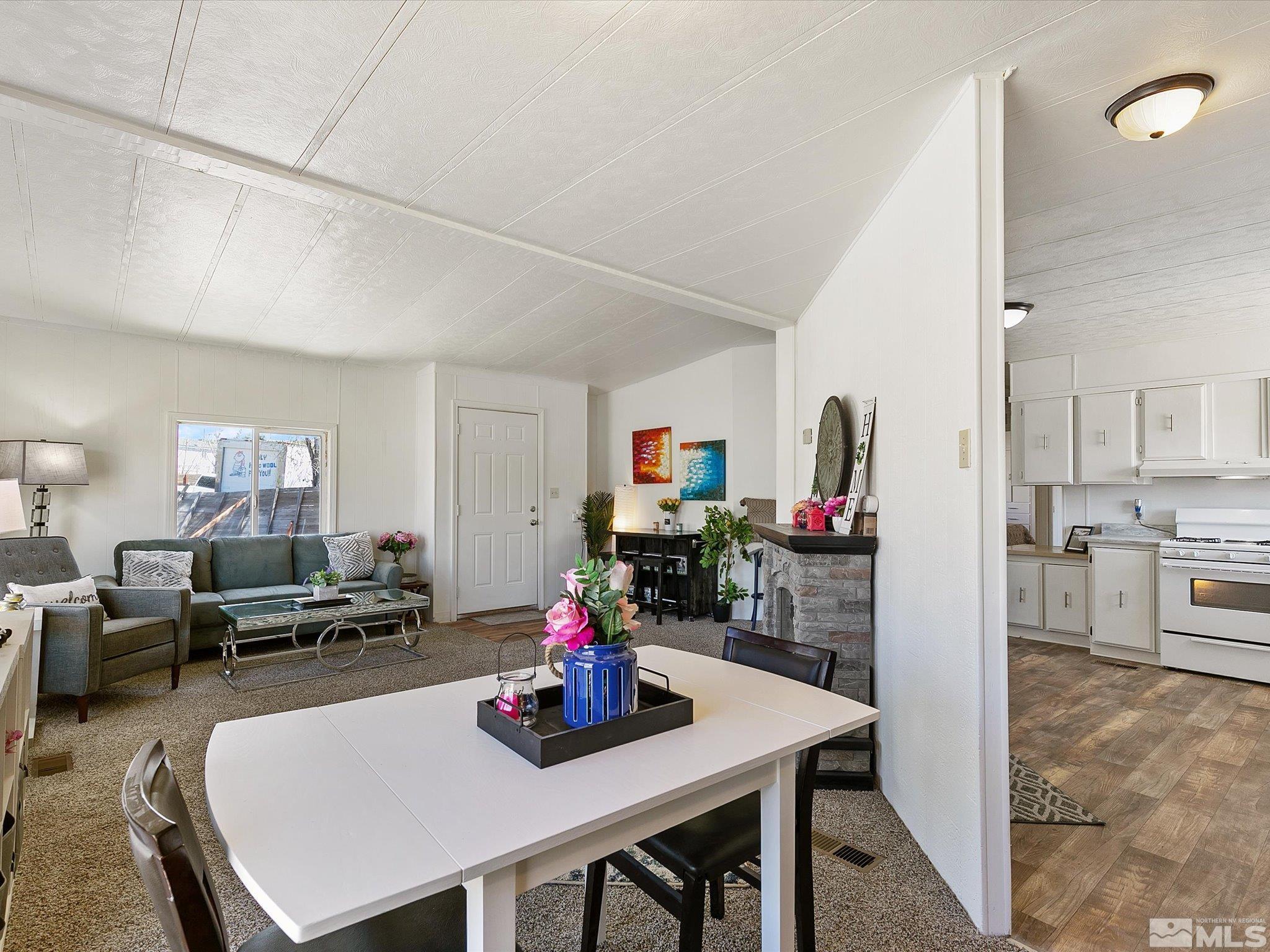 17560 Thrush Lane Reno, NV 89508 - Photo 8 of 27 a view of a dining room with furniture and a chandelier