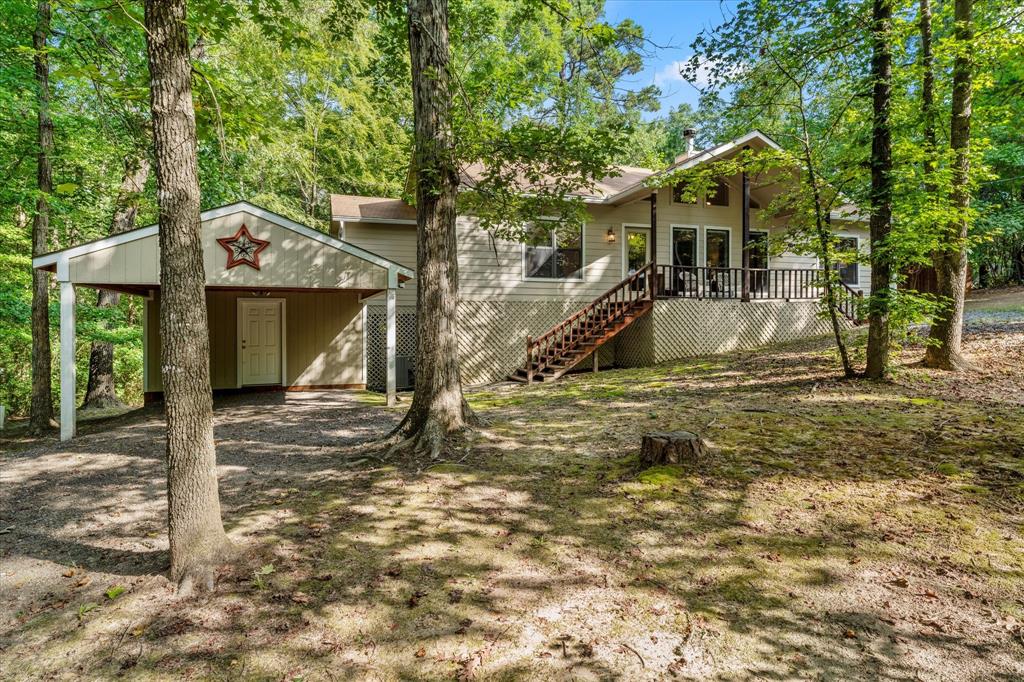 211 Butternut Glen Holly Lake Ranch, TX 75765 - Photo 1 of 1 a view of a house with a yard