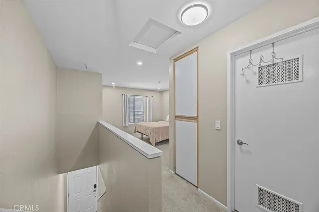 a view of a hallway with closet