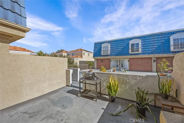 a view of a chairs and table in a patio