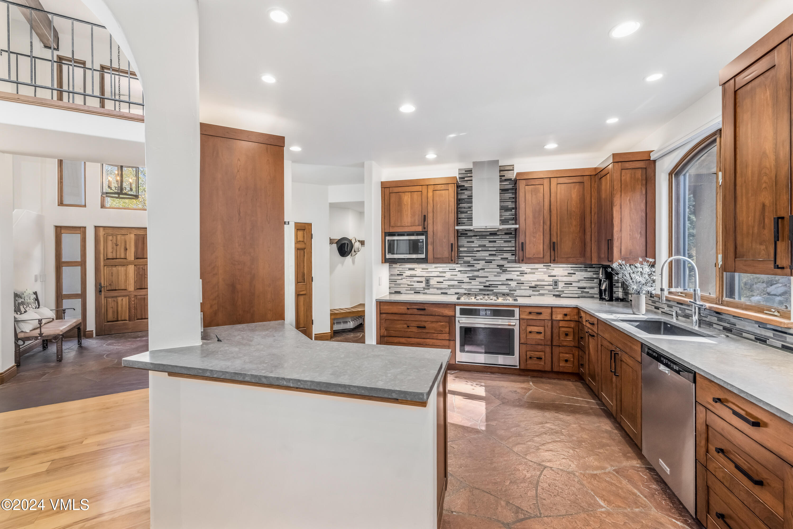 2076 Vermont Road Vail, CO 81657 - Photo 11 of 39 a large kitchen with stainless steel appliances granite countertop a stove and a sink