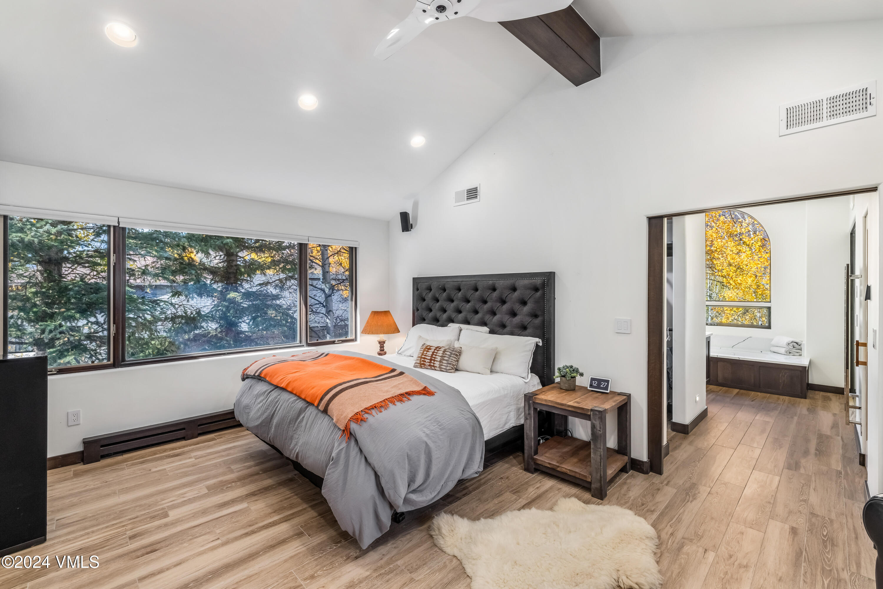 2076 Vermont Road Vail, CO 81657 - Photo 16 of 39 a bedroom with a bed and wooden floor