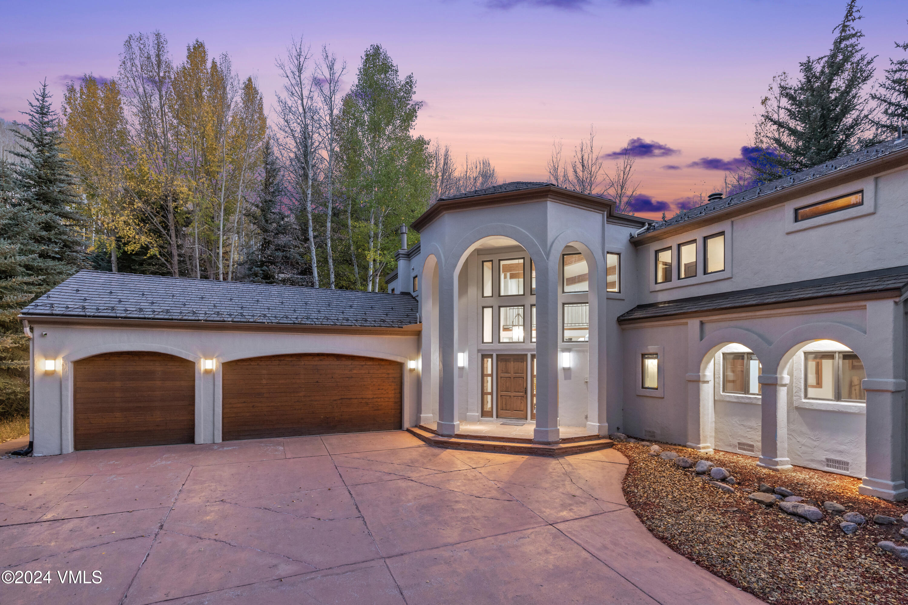 2076 Vermont Road Vail, CO 81657 - Photo 2 of 39 a front view of a house with yard
