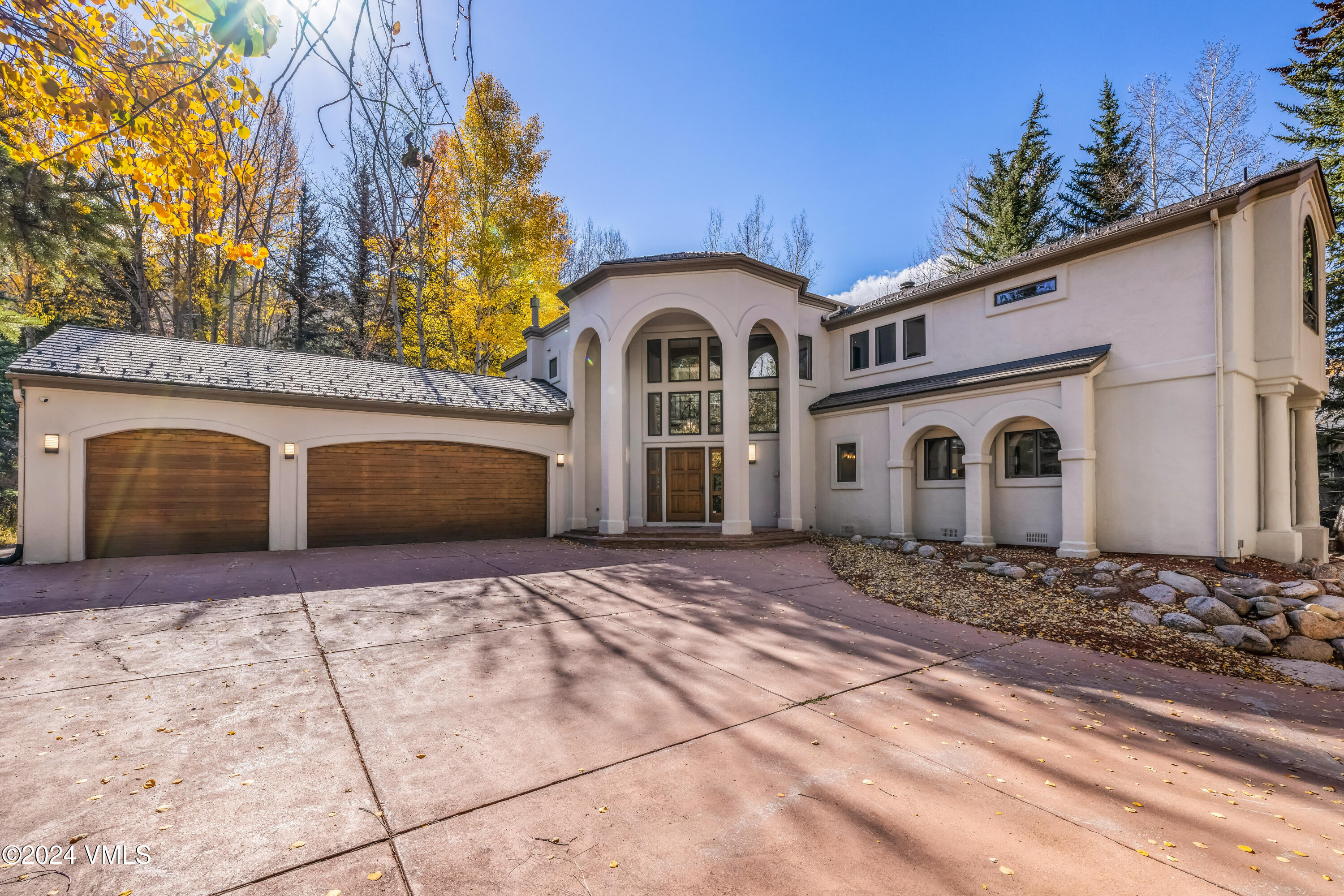 2076 Vermont Road Vail, CO 81657 - Photo 21 of 39 a front view of a house with a yard