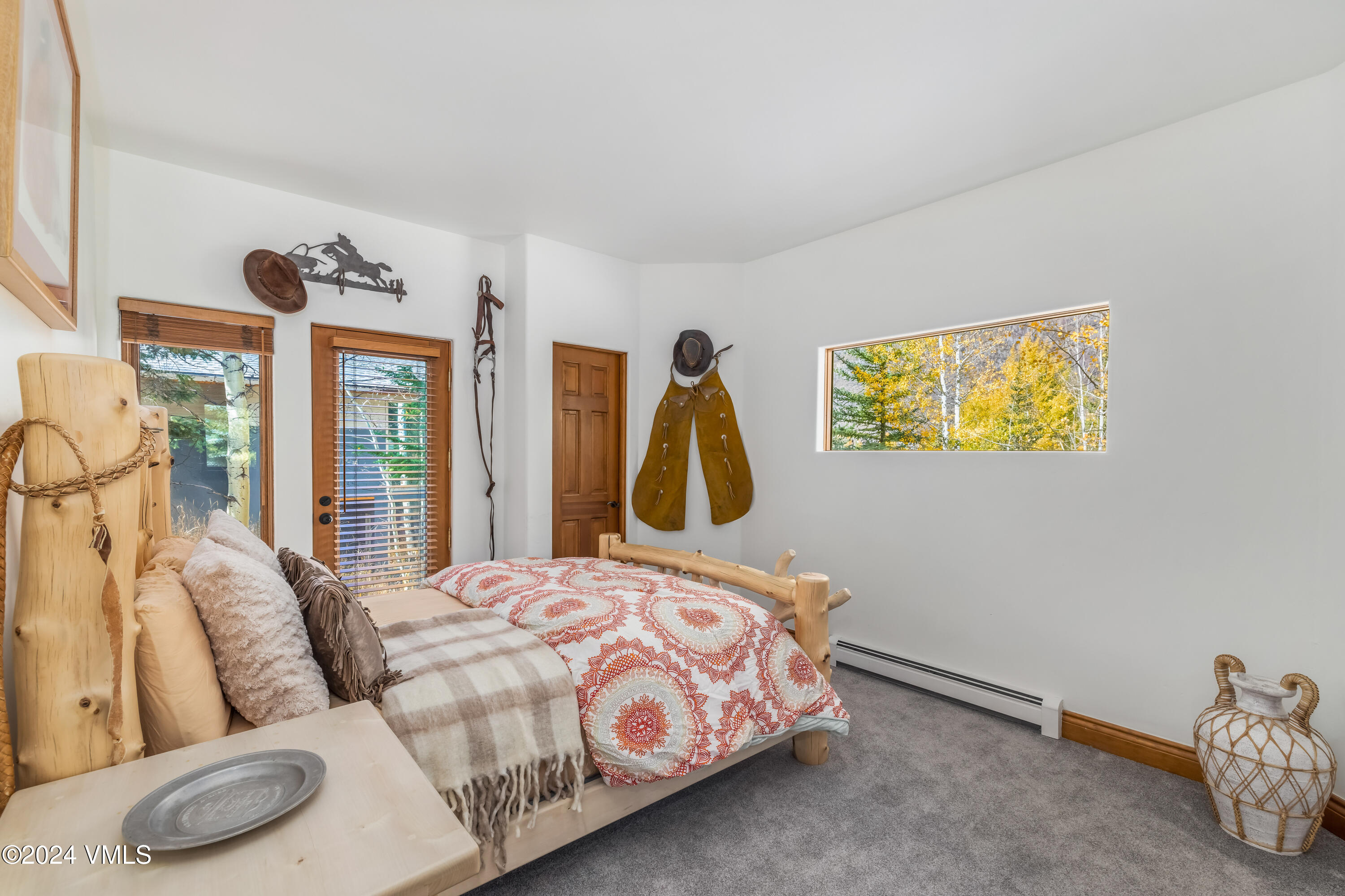 2076 Vermont Road Vail, CO 81657 - Photo 24 of 39 a bedroom with a bed and a painting on the wall