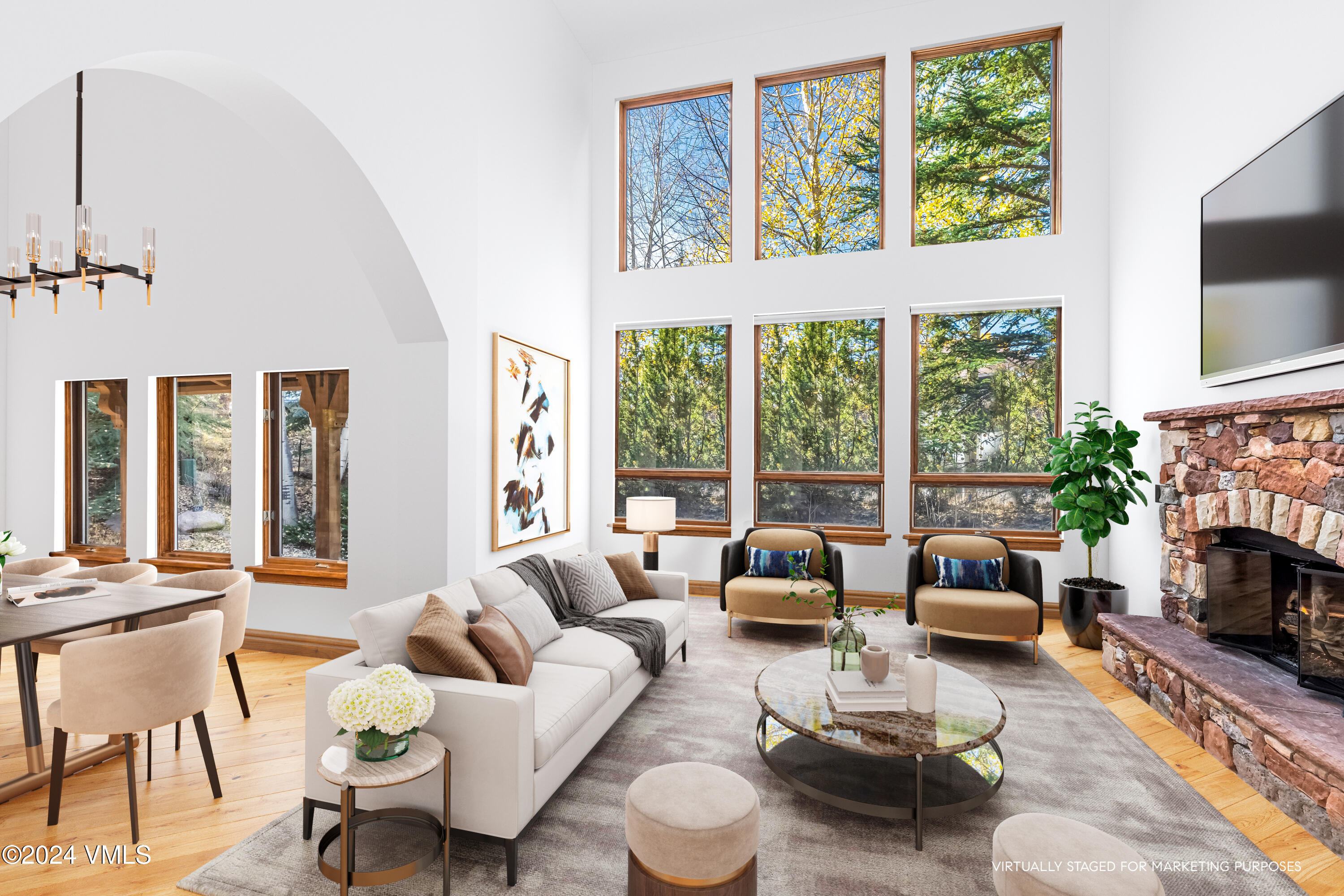 2076 Vermont Road Vail, CO 81657 - Photo 6 of 39 a living room with furniture large window and a flat screen tv