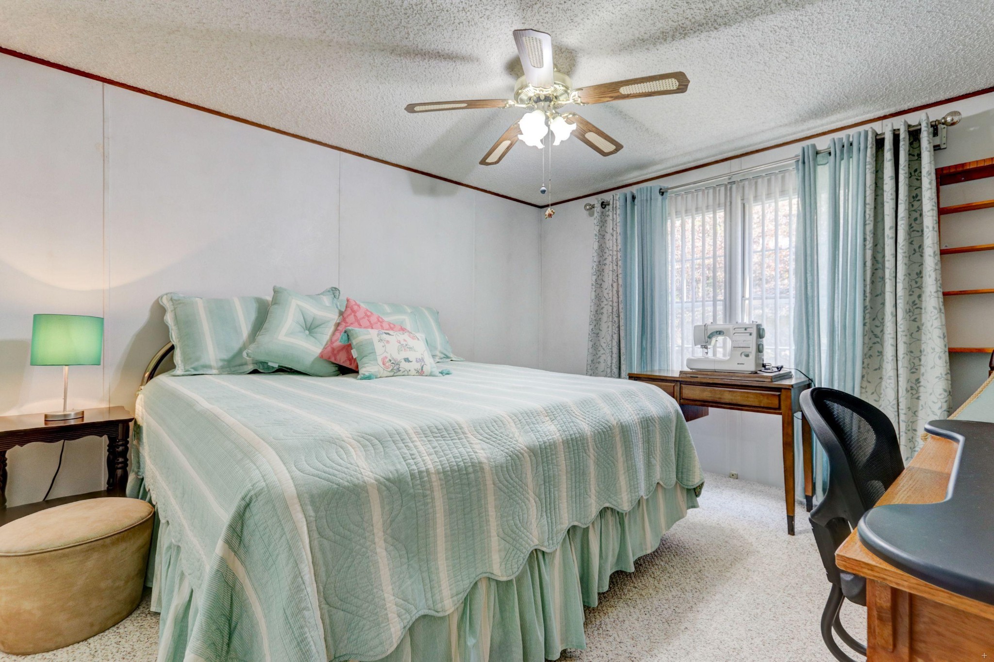 645 Apple Valley Road Sevierville, TN 37862 - Photo 17 of 32 a bedroom with a bed and a chandelier