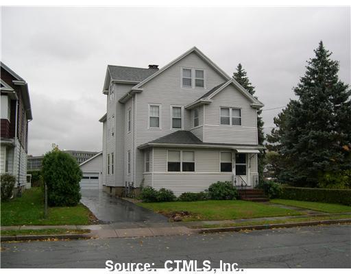 81 Victoria Road Hartford, CT 06114 - Photo 1 of 1 a front view of a house with a yard