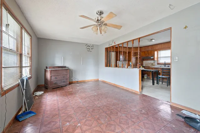 a view of livingroom with furniture and chandelier fan