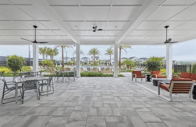 a tennis court that has potted plants