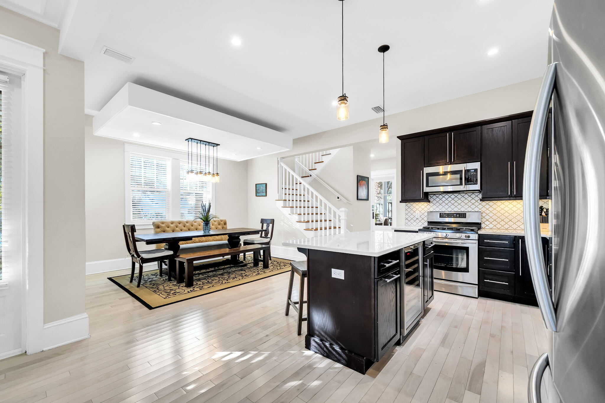 13 Eastern Lake Court Santa Rosa Beach, FL 32459 - Photo 16 of 58 a kitchen with stainless steel appliances kitchen island hardwood floor and a sink