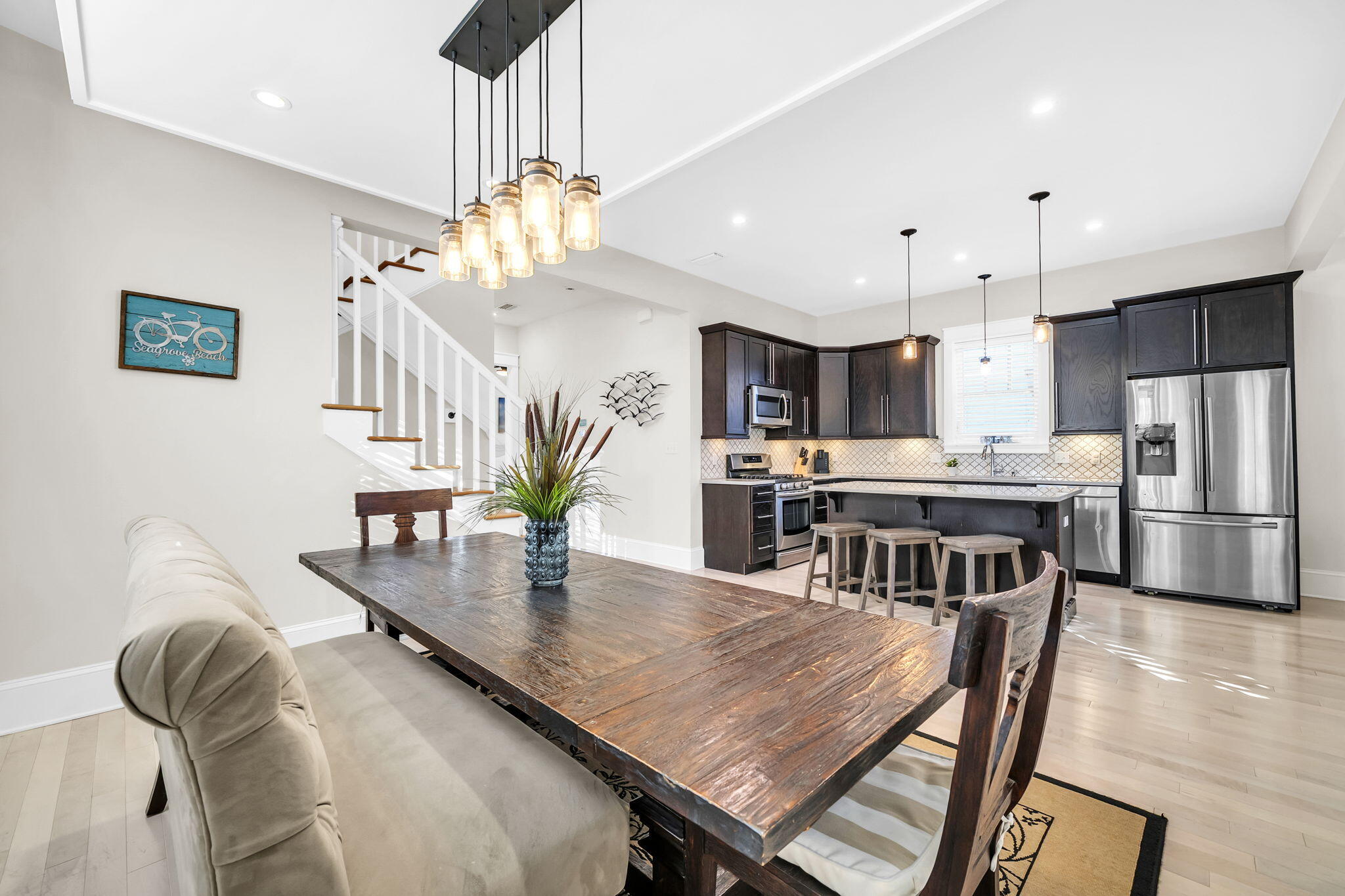 13 Eastern Lake Court Santa Rosa Beach, FL 32459 - Photo 19 of 58 a kitchen with kitchen island a dining table chairs stainless steel appliances and cabinets