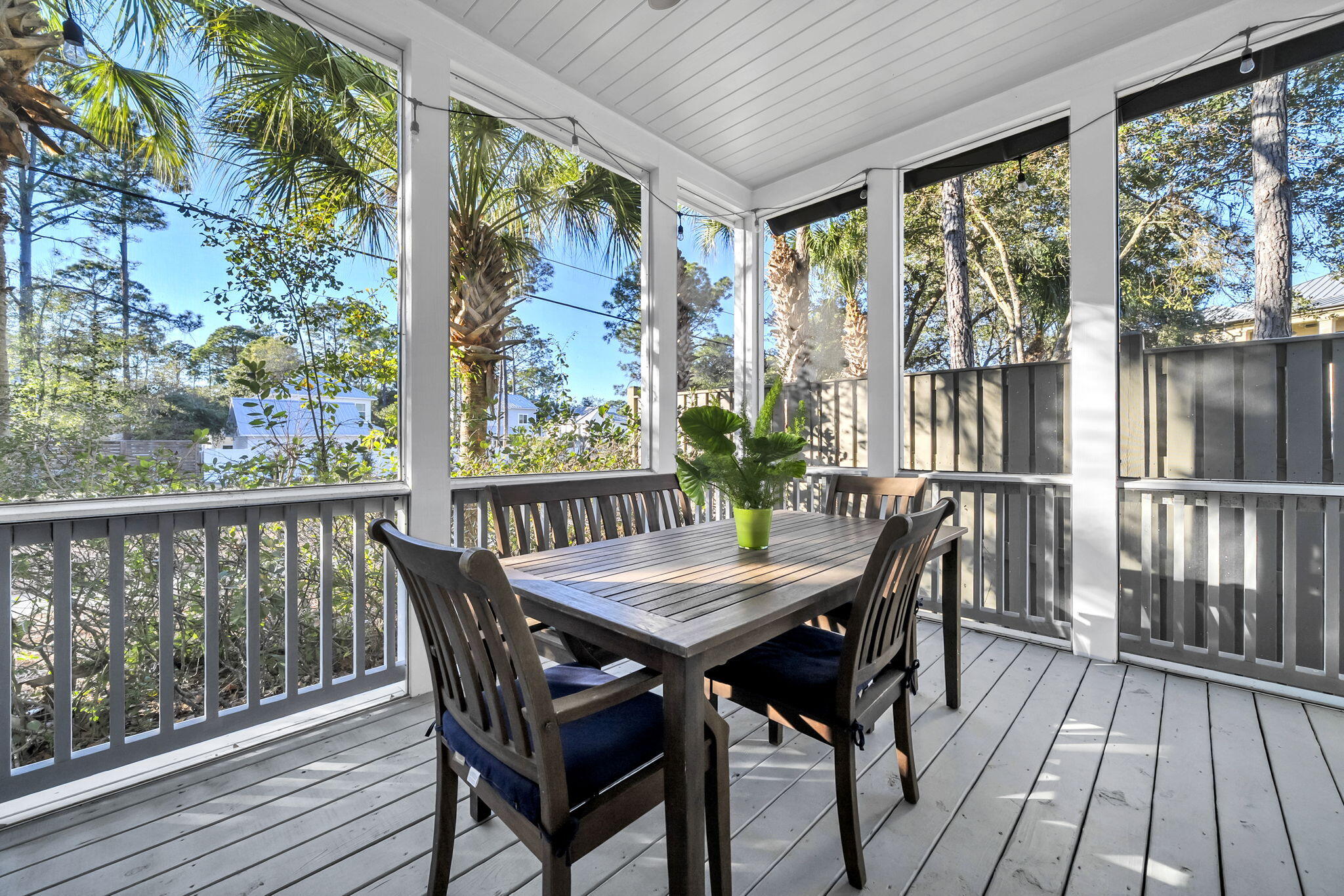 13 Eastern Lake Court Santa Rosa Beach, FL 32459 - Photo 26 of 58 a view of a balcony with table and chairs