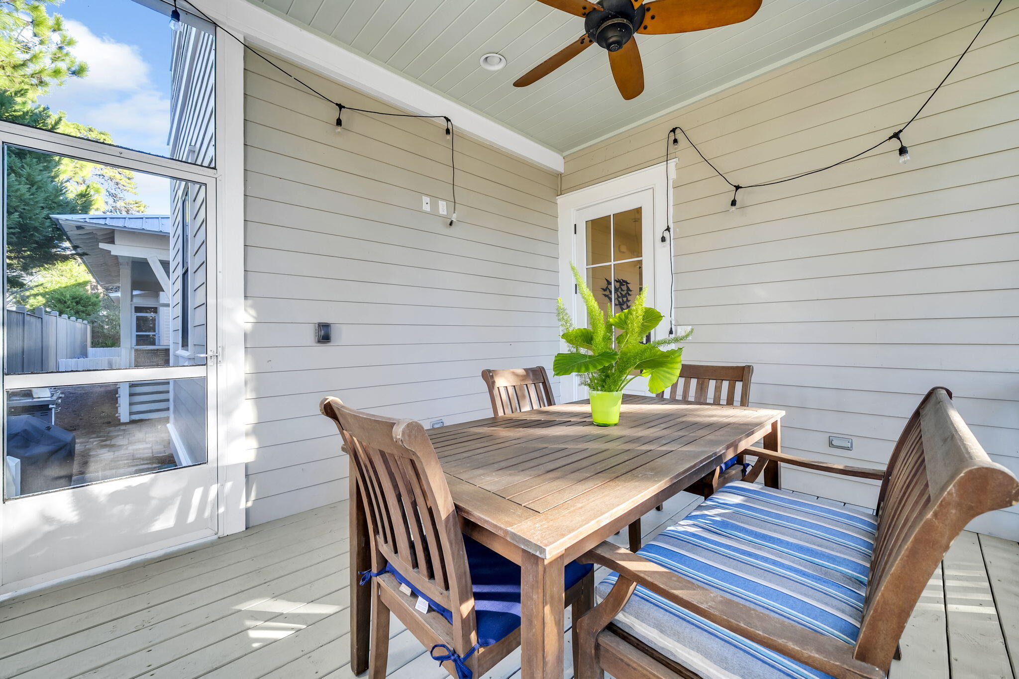 13 Eastern Lake Court Santa Rosa Beach, FL 32459 - Photo 27 of 58 a view of a patio with table and chairs and potted plants
