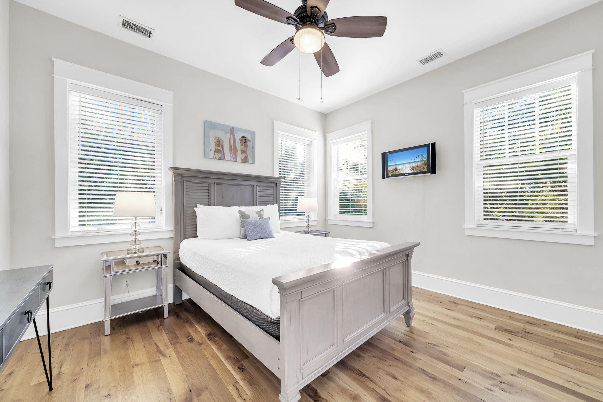 13 Eastern Lake Court Santa Rosa Beach, FL 32459 - Photo 41 of 58 a large bed sitting in a bedroom next to a window and a chandelier