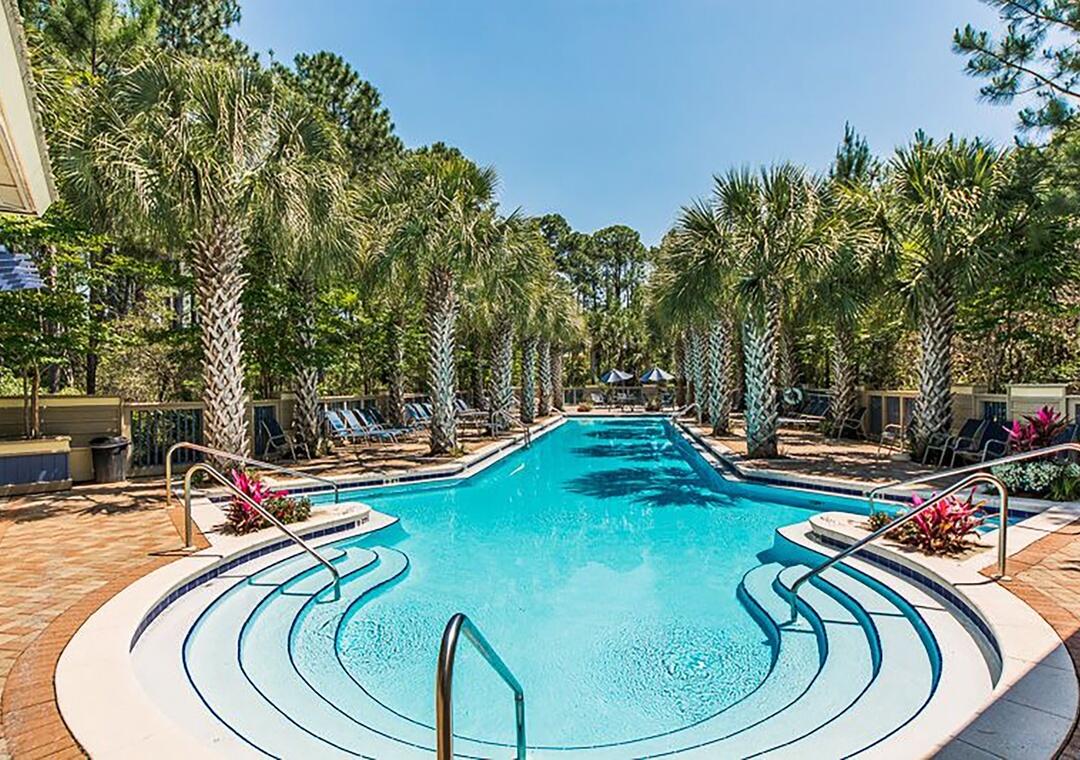 13 Eastern Lake Court Santa Rosa Beach, FL 32459 - Photo 52 of 58 a view of a swimming pool with a dining table and chairs