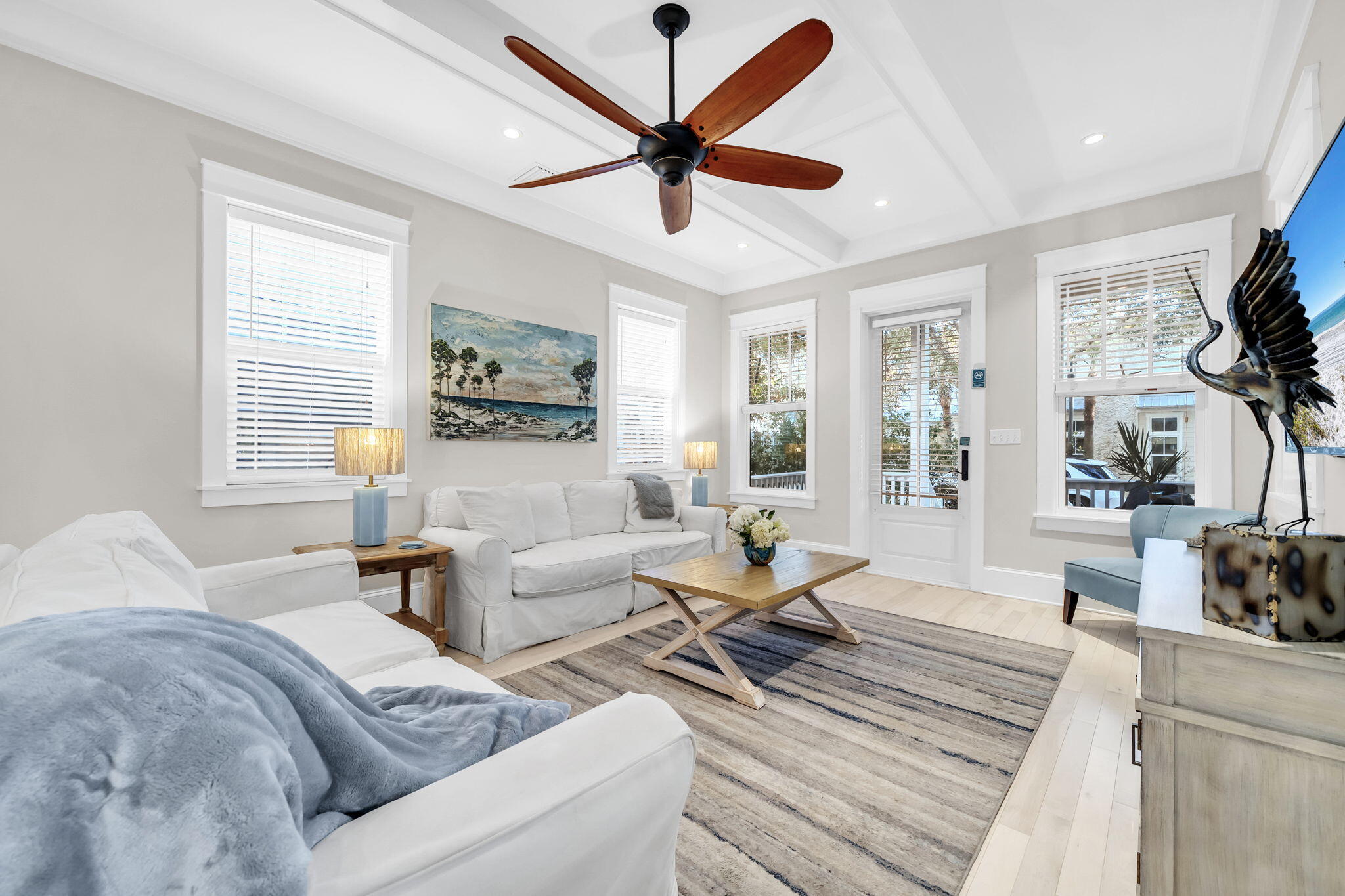 13 Eastern Lake Court Santa Rosa Beach, FL 32459 - Photo 10 of 58 a living room with furniture a chandelier and a large window