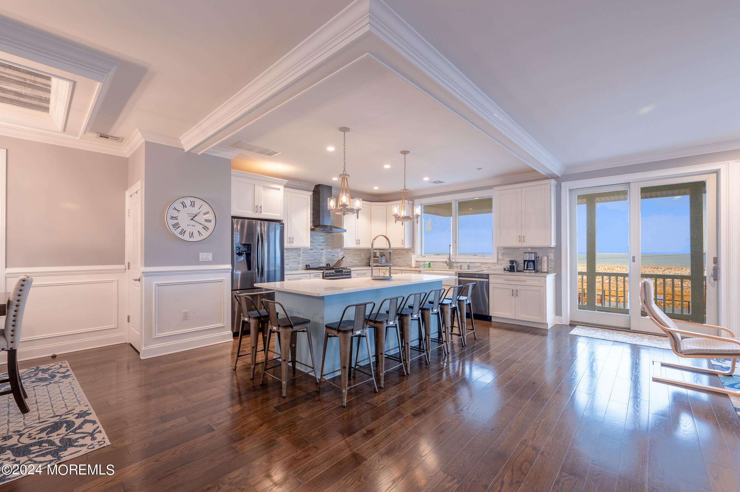 1851 Oceanfront Seaside Heights, NJ 08751 - Photo 12 of 66 a dining room with stainless steel appliances a dining table chairs and view of kitchen