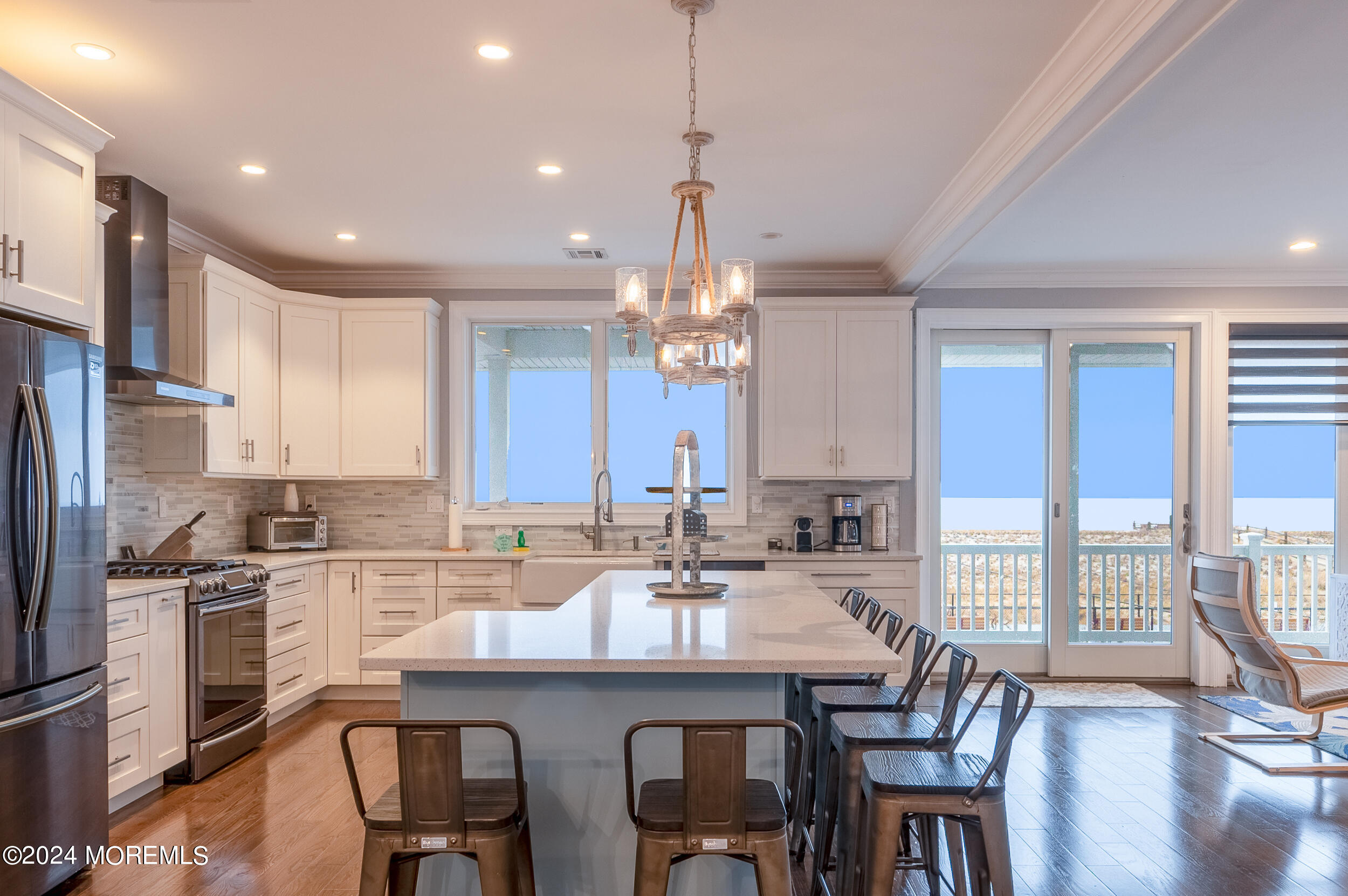 1851 Oceanfront Seaside Heights, NJ 08751 - Photo 14 of 66 a kitchen with granite countertop a sink and stove