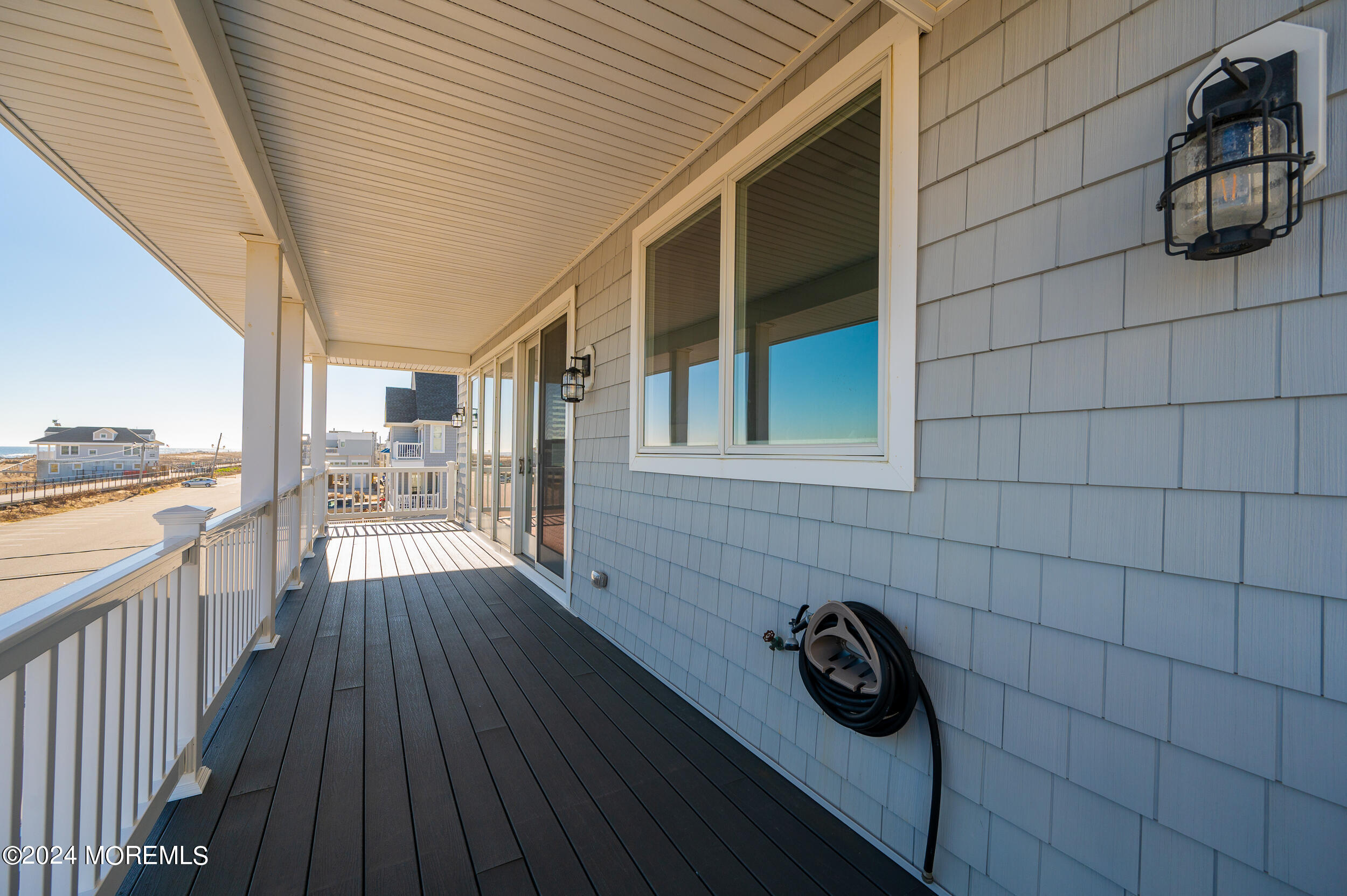 1851 Oceanfront Seaside Heights, NJ 08751 - Photo 37 of 66 a view of roof deck with wooden floor and fence