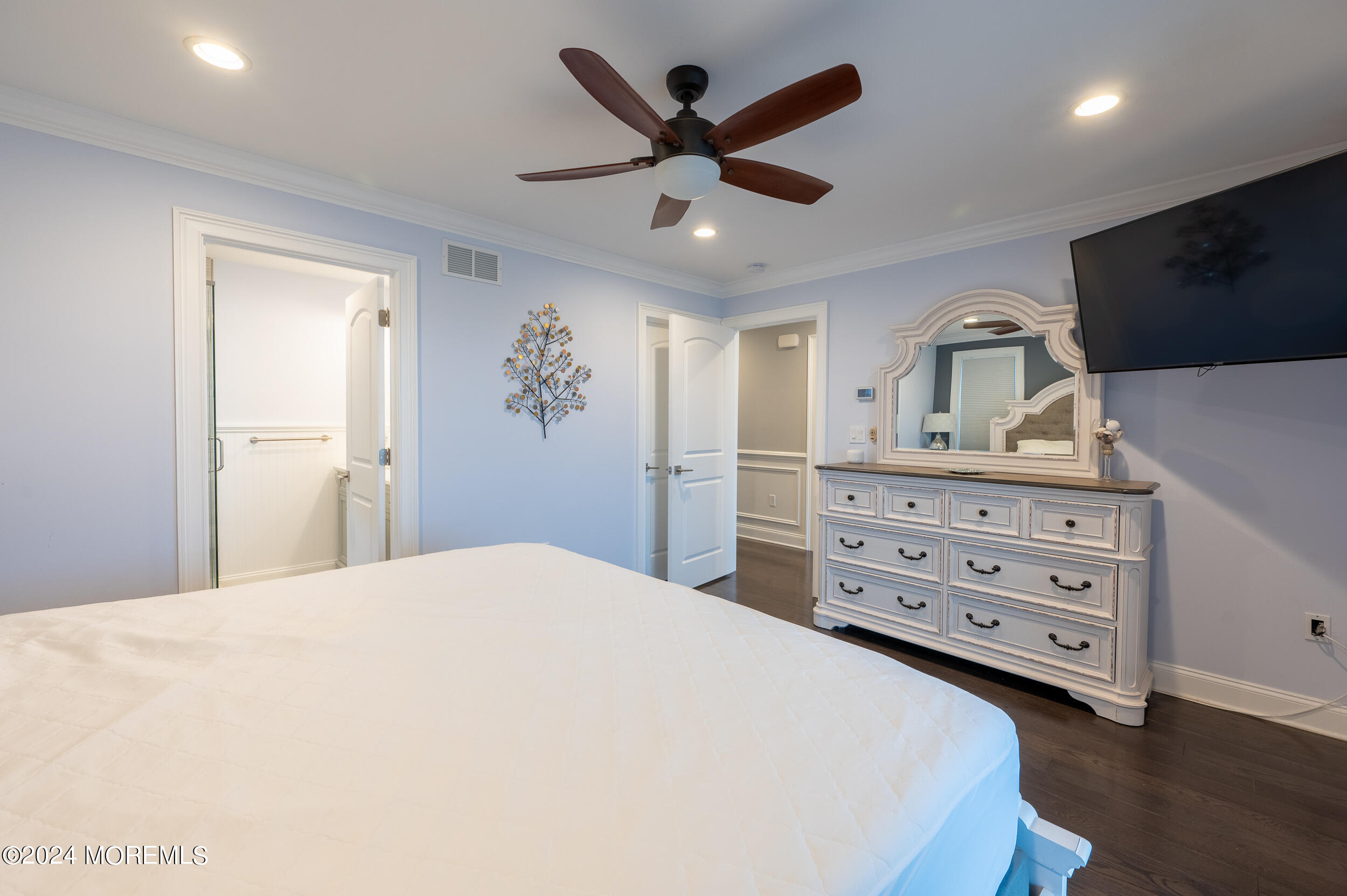 1851 Oceanfront Seaside Heights, NJ 08751 - Photo 40 of 66 a spacious bedroom with a bed and a flat screen tv