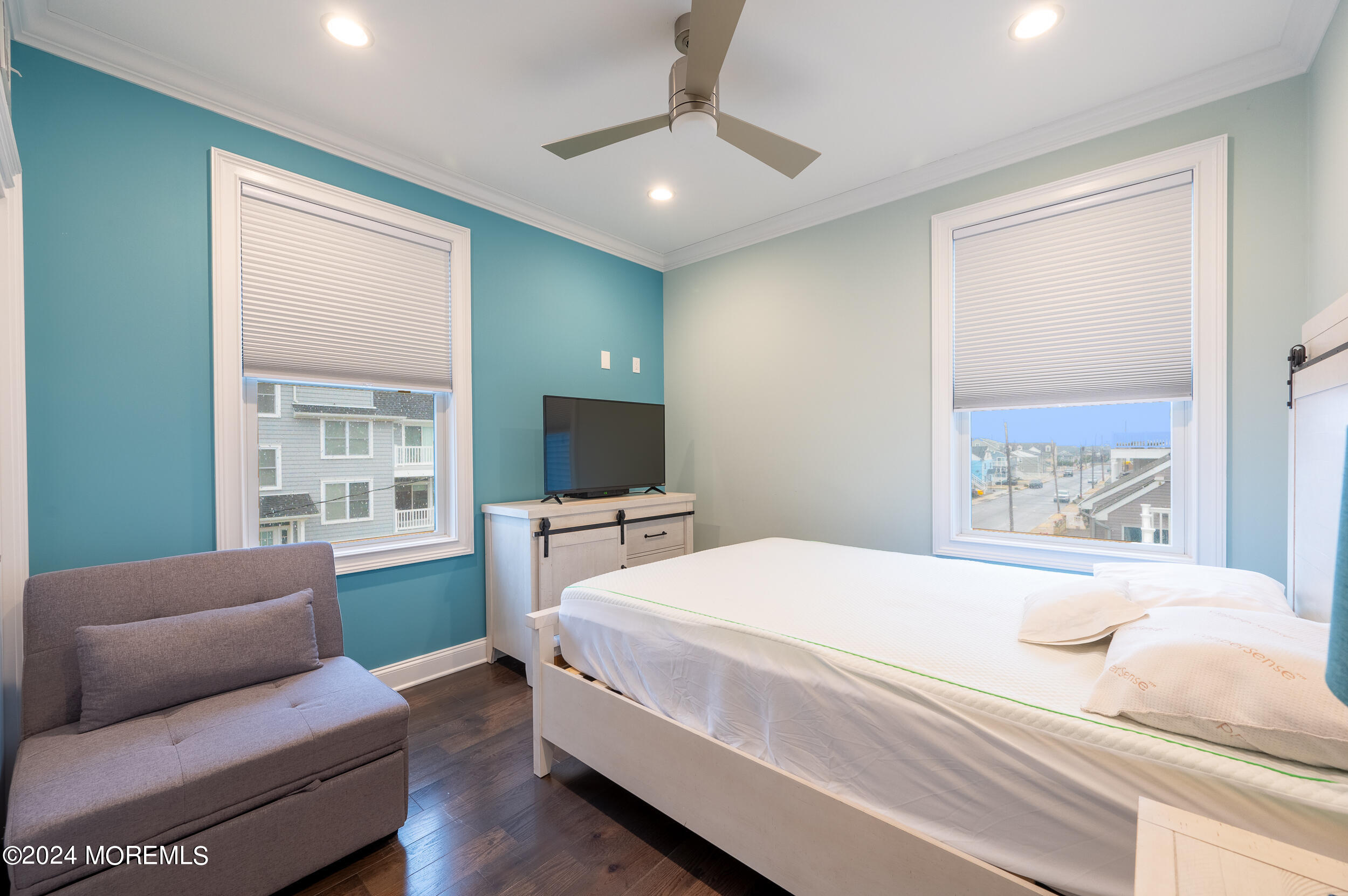 1851 Oceanfront Seaside Heights, NJ 08751 - Photo 49 of 66 a bedroom with a bed and a flat screen tv