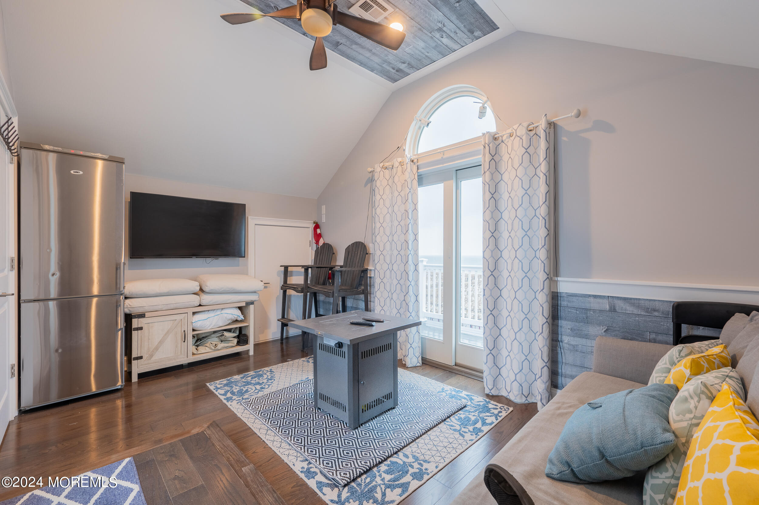 1851 Oceanfront Seaside Heights, NJ 08751 - Photo 51 of 66 a living room with furniture and a flat screen tv
