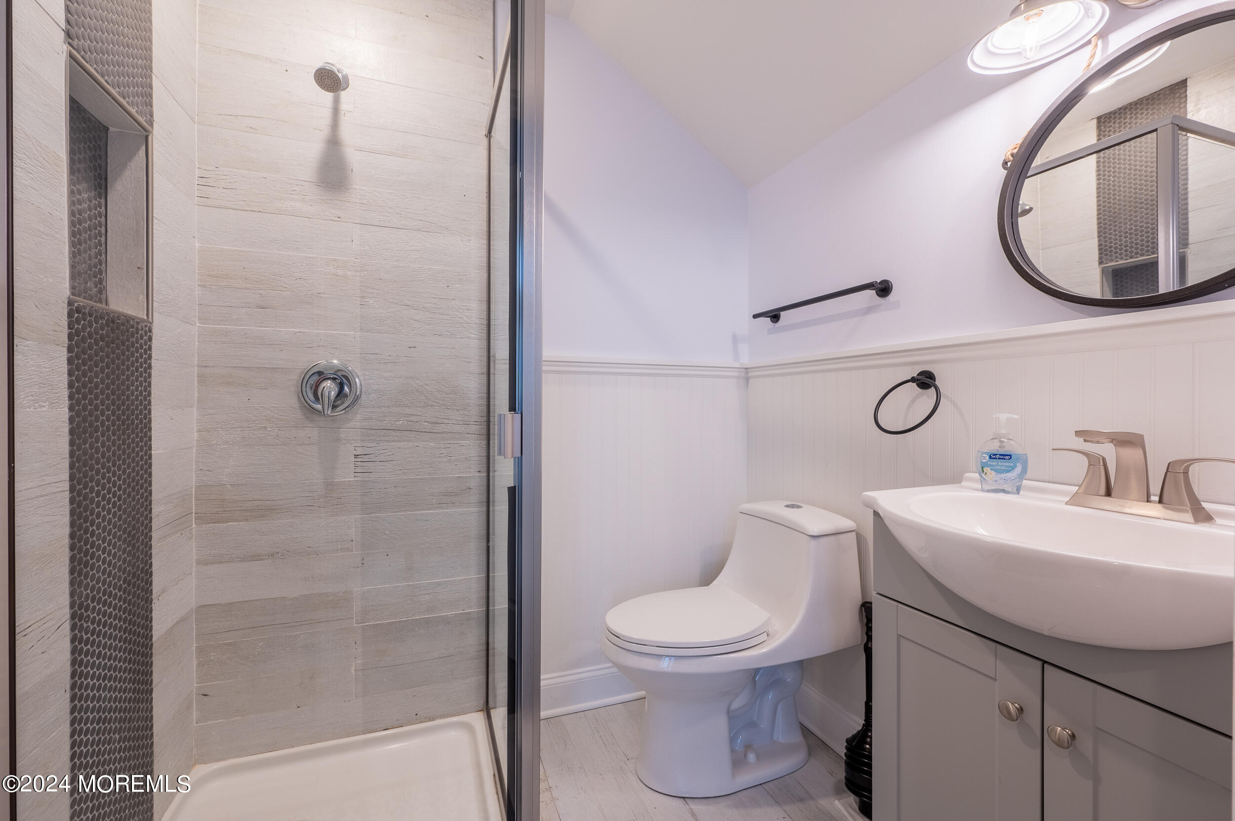 1851 Oceanfront Seaside Heights, NJ 08751 - Photo 52 of 66 a bathroom with a toilet sink and mirror