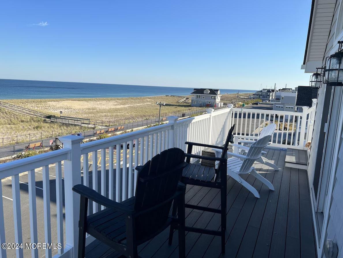 1851 Oceanfront Seaside Heights, NJ 08751 - Photo 53 of 66 a view of a balcony with wooden floor and outdoor seating