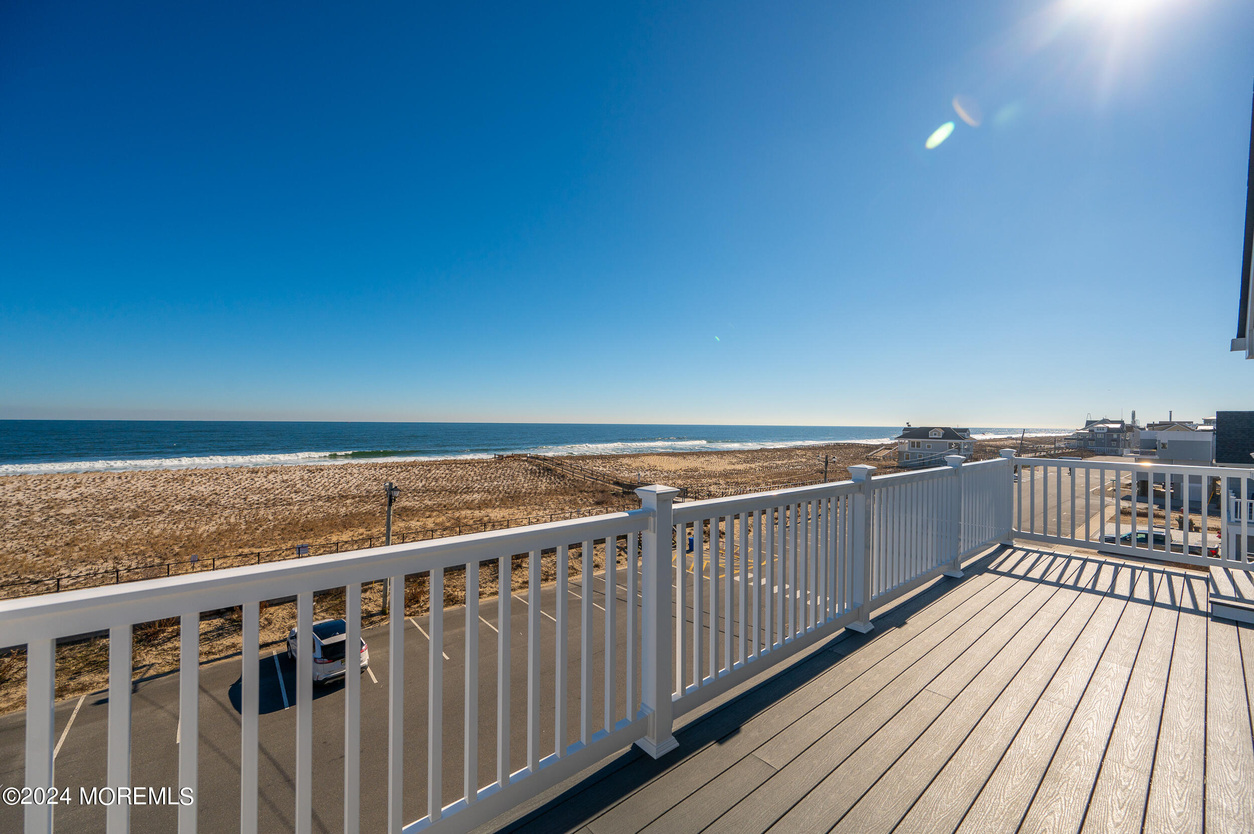 1851 Oceanfront Seaside Heights, NJ 08751 - Photo 9 of 66 a view of roof deck with wooden floor and fence