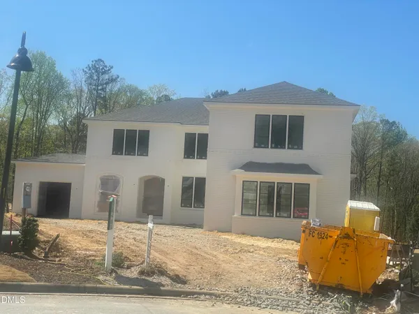 a front view of a house with yard