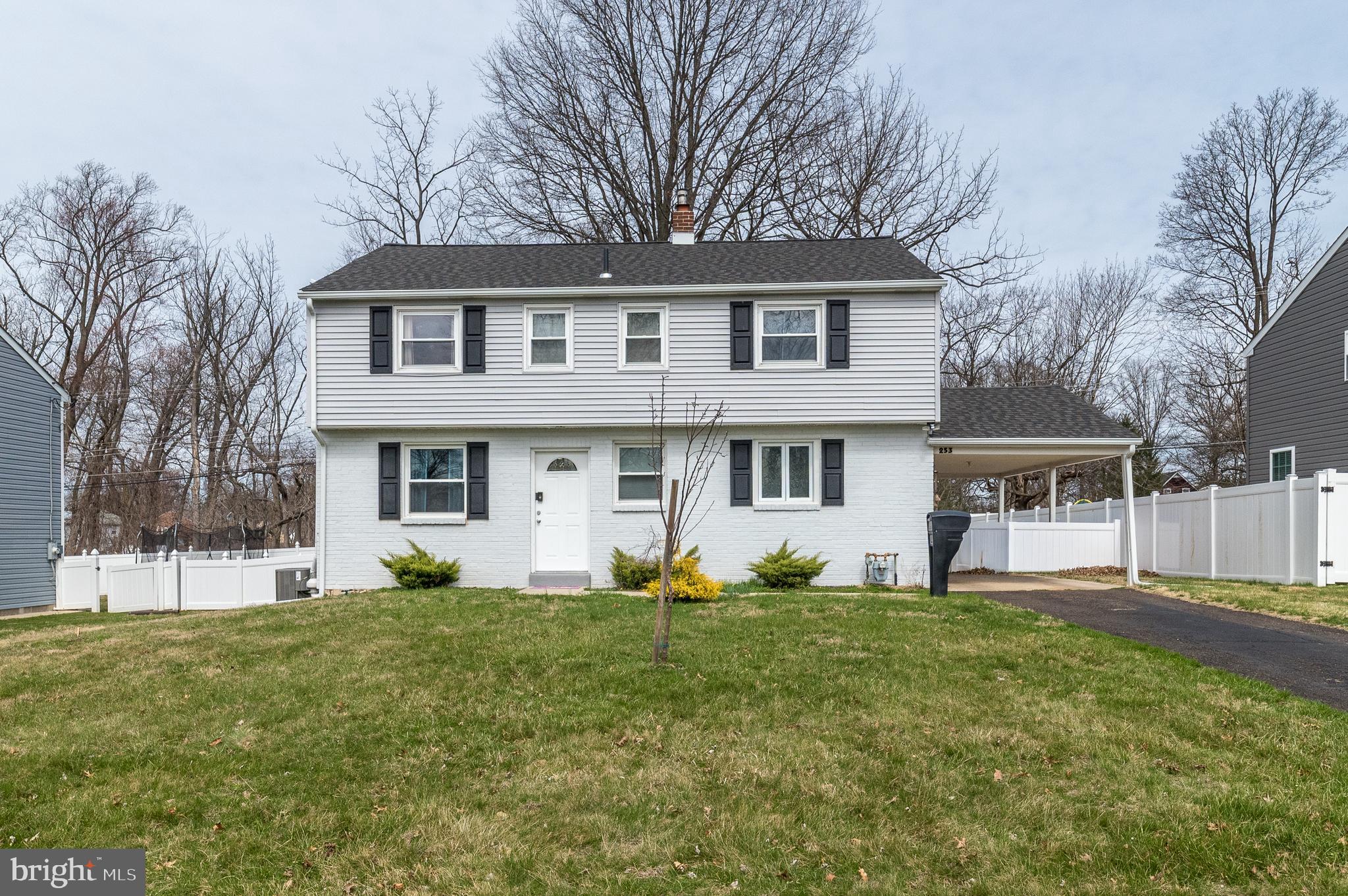 253 Luff Lane Warminster, PA 18974 - Photo 1 of 30 a front view of a house with a yard and trees