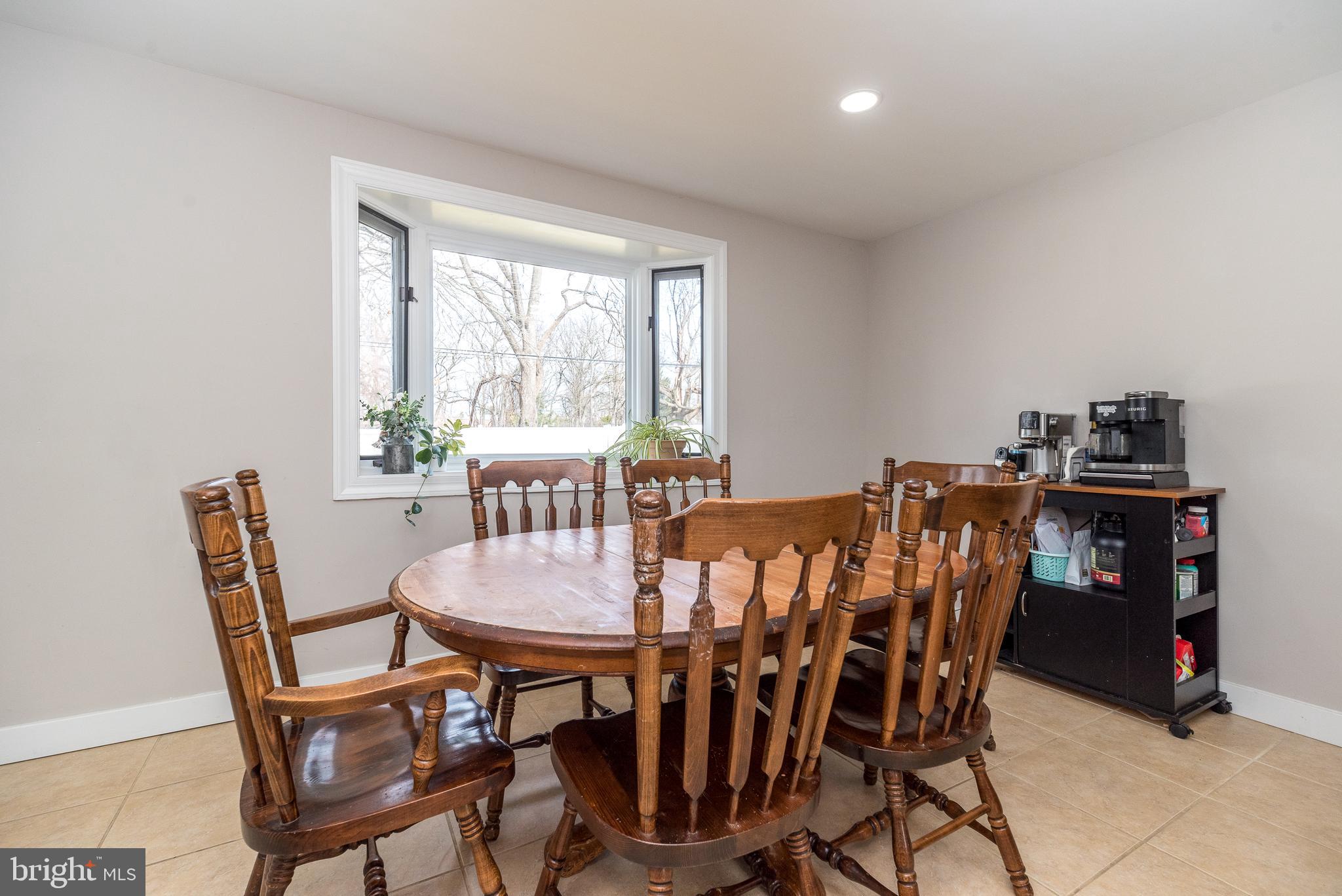253 Luff Lane Warminster, PA 18974 - Photo 13 of 30 a view of a dining room with furniture and a window