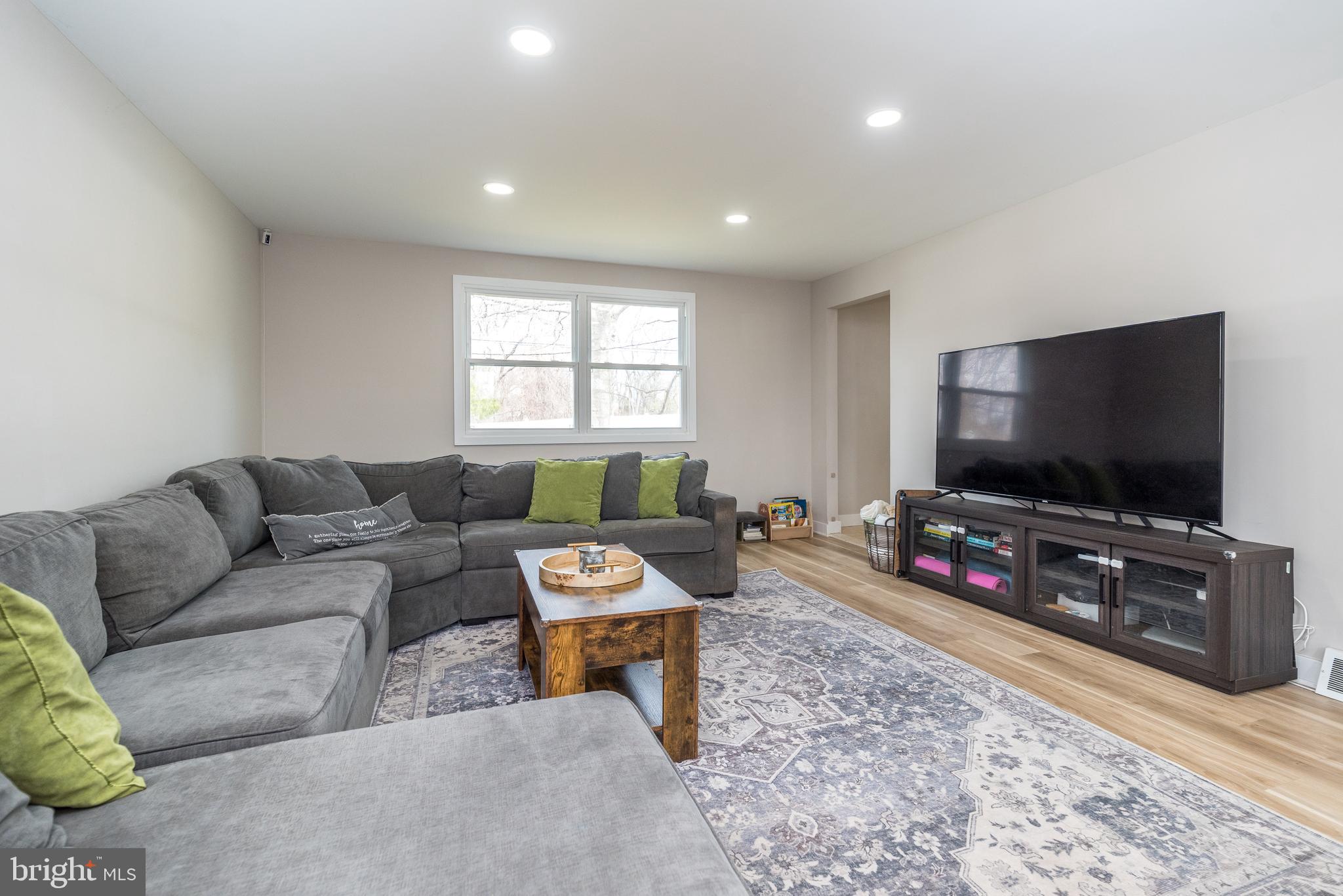 253 Luff Lane Warminster, PA 18974 - Photo 18 of 30 a living room with furniture and a flat screen tv