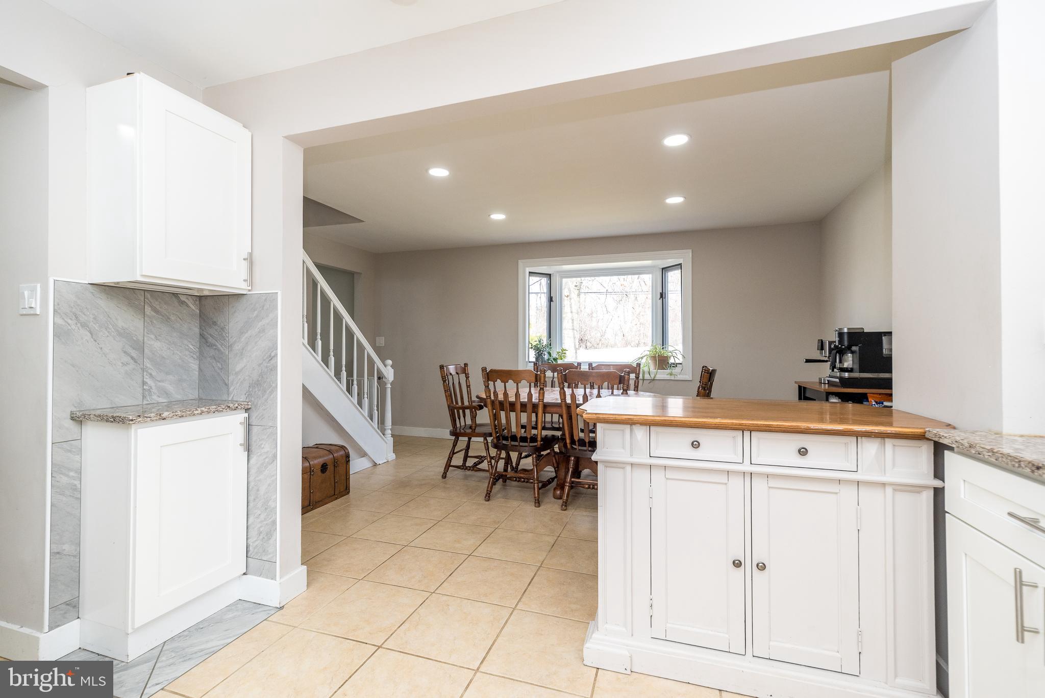 253 Luff Lane Warminster, PA 18974 - Photo 10 of 30 a kitchen with furniture and a stove top oven