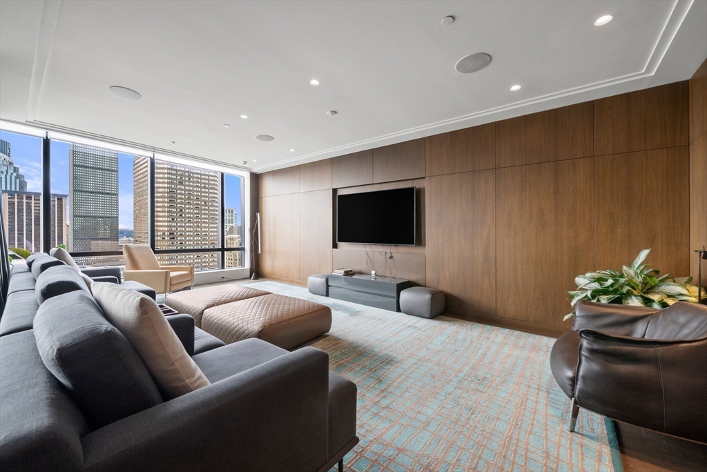 40 Trinity Place, Unit 1518 Boston, MA 02116 - Photo 15 of 25 a living room with furniture and a flat screen tv
