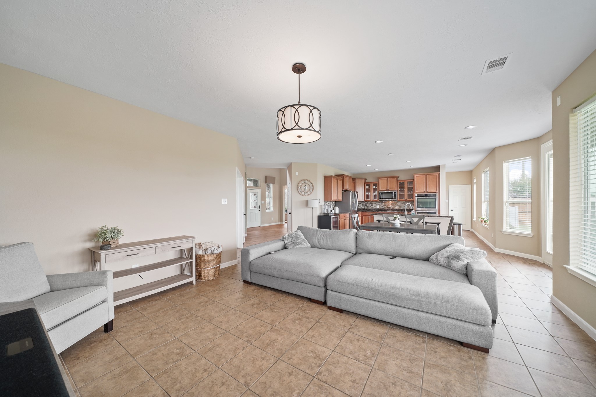 2502 J. R. Drive Manvel, TX 77578 - Photo 13 of 31 a living room with furniture and a chandelier