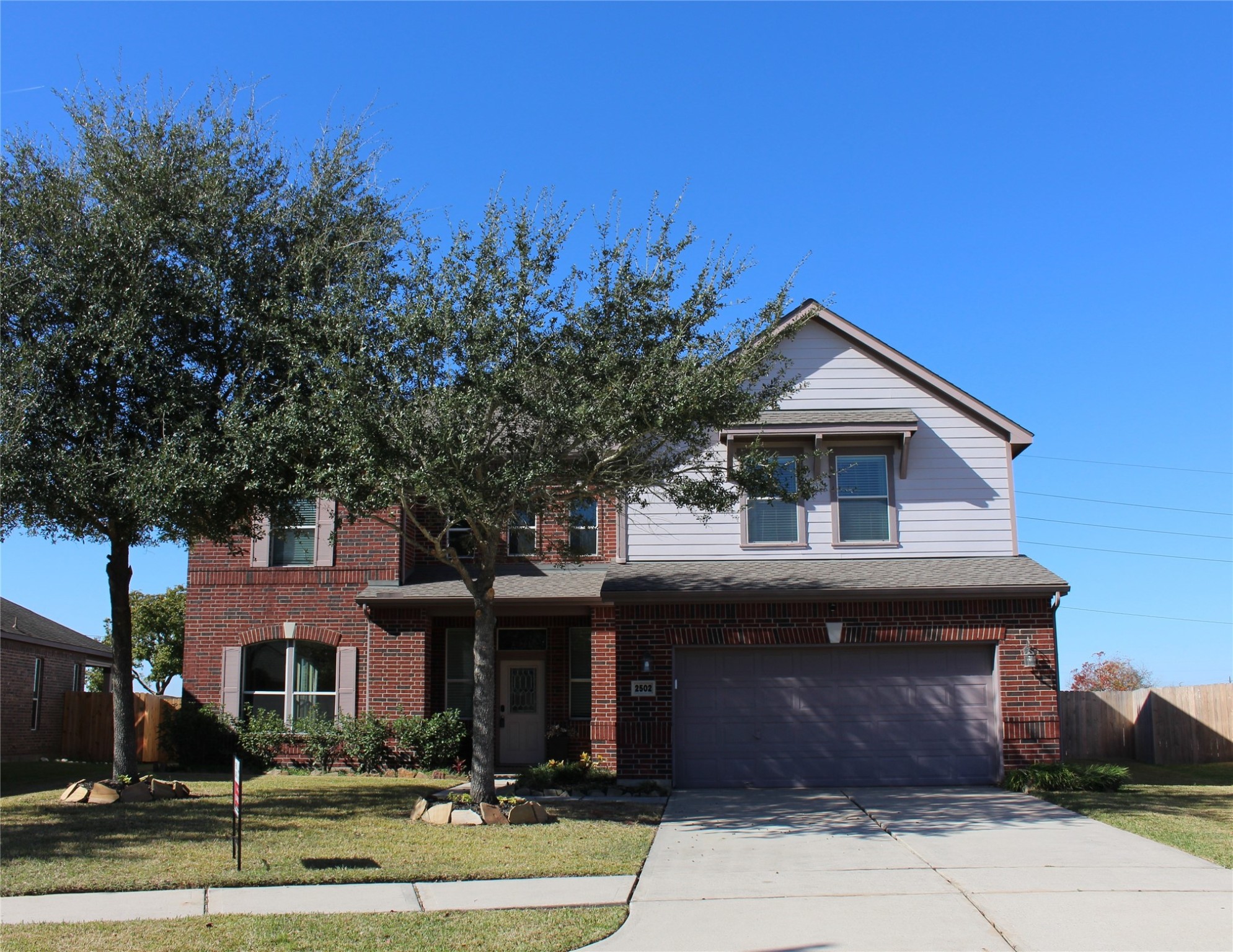 2502 J. R. Drive Manvel, TX 77578 - Photo 2 of 31 a front view of a house with a yard