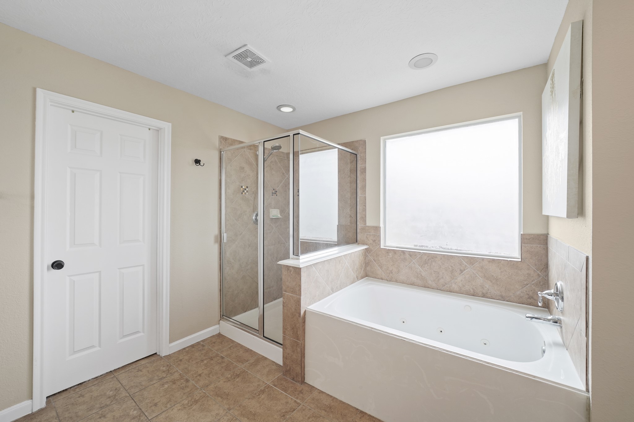 2502 J. R. Drive Manvel, TX 77578 - Photo 21 of 31 a bathroom with a bathtub and a shower