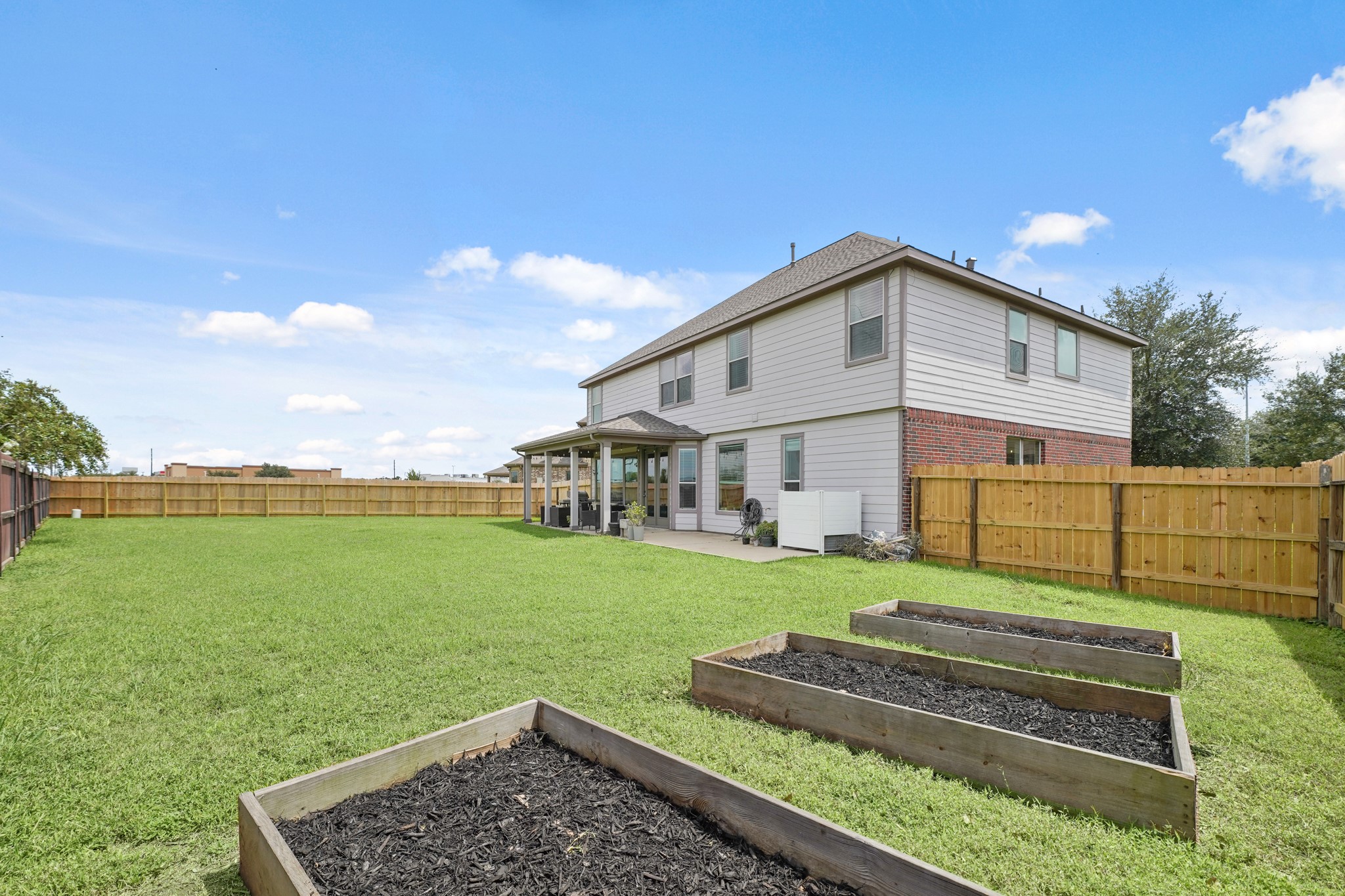 2502 J. R. Drive Manvel, TX 77578 - Photo 30 of 31 a front view of a house with garden