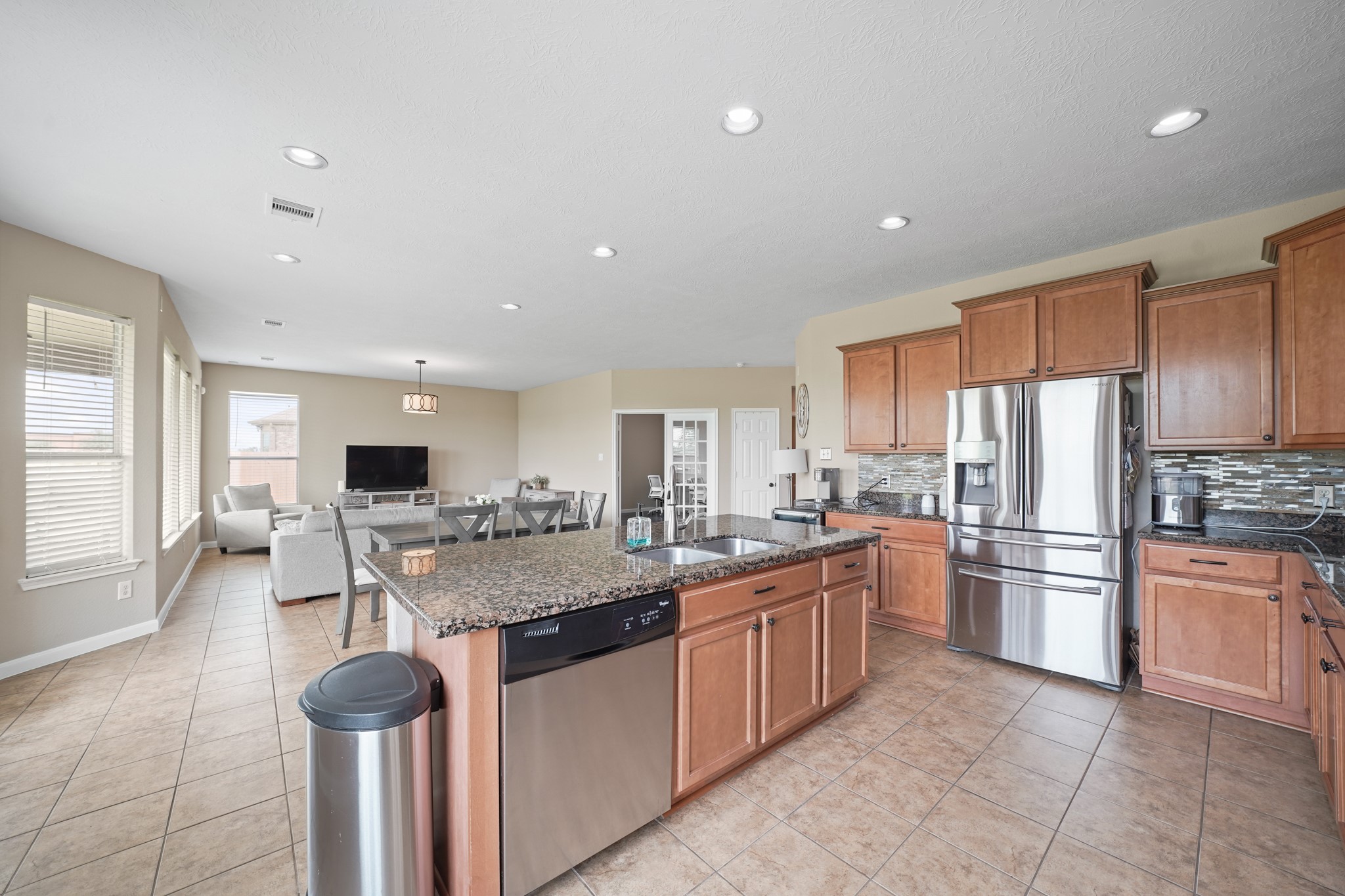 2502 J. R. Drive Manvel, TX 77578 - Photo 7 of 31 a kitchen with stainless steel appliances granite countertop a sink and stove