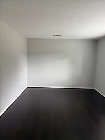 a view of an empty room and a window