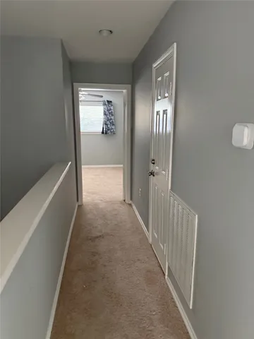 a view of hallway with stairs