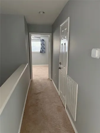 a view of hallway with stairs