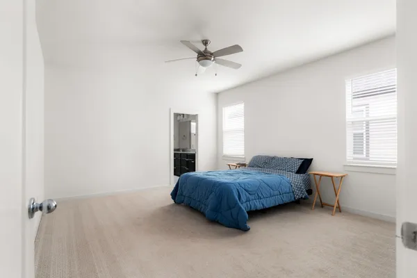 a room with a bed and window