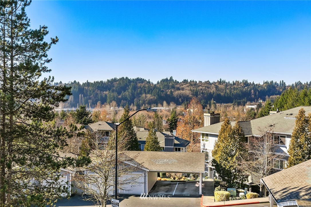 3926 243rd Place Southeast, Unit H301 Bothell, WA 98021 - Photo 12 of 16 an aerial view of a house with a garden and trees