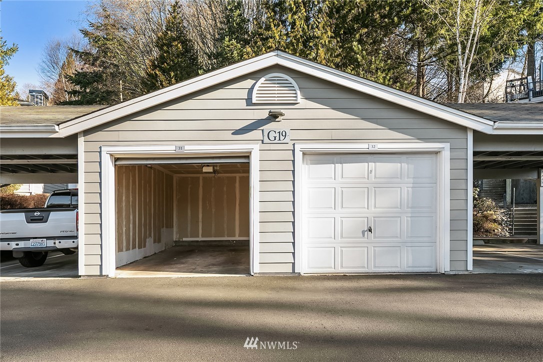 3926 243rd Place Southeast, Unit H301 Bothell, WA 98021 - Photo 13 of 16 a front view of a house with a garage